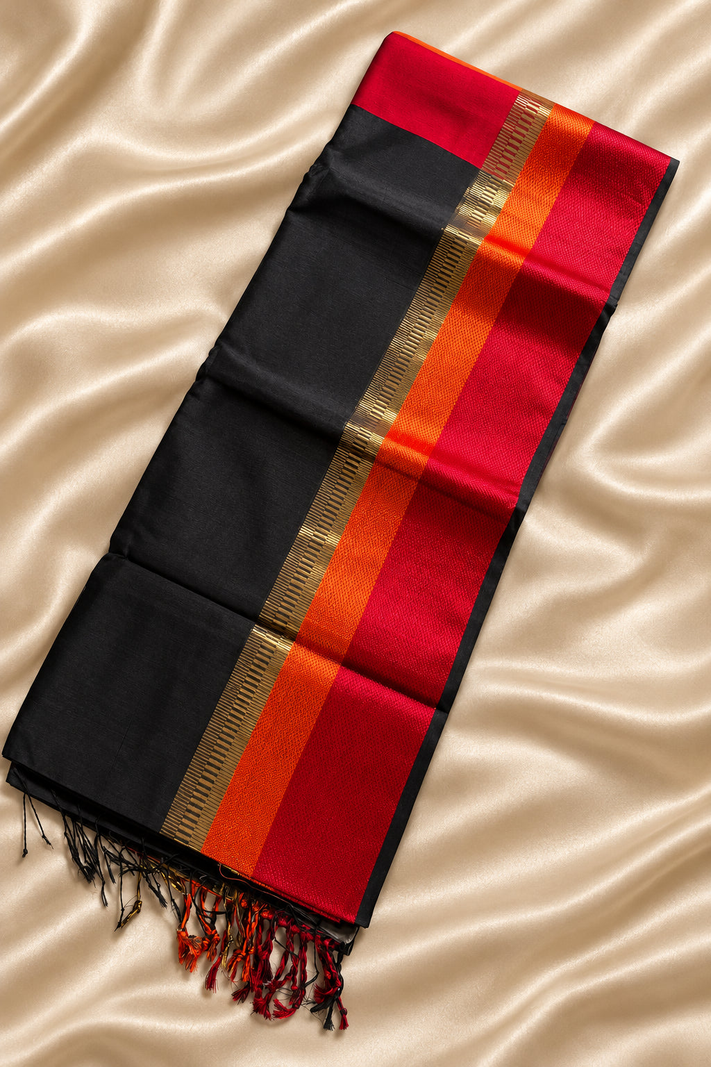 Black Maheshwari saree with red , orange and gold zari border